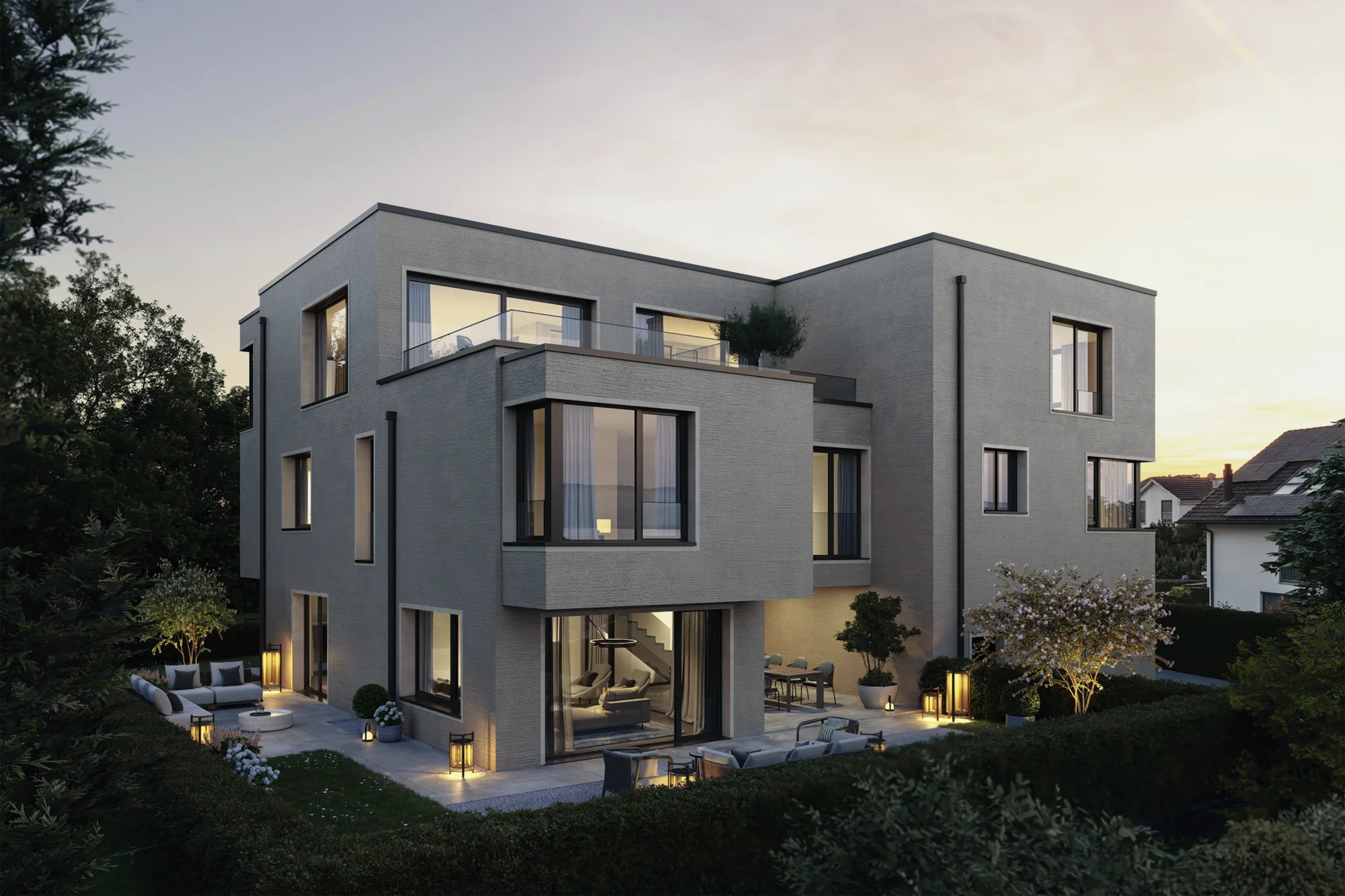 Exterior rendering of N7 in Buonas with a garden, outdoor seating and illuminated living spaces at dusk.